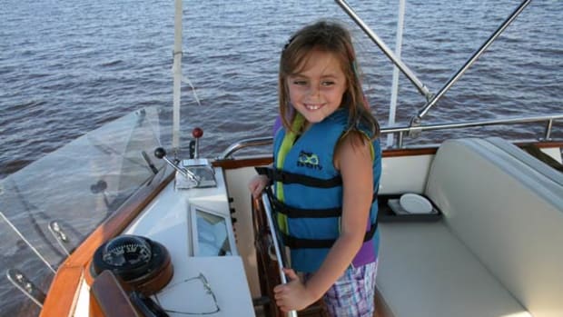 little girl at helm of Betty Jane