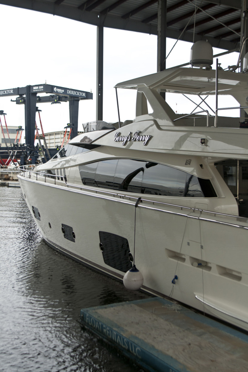 A freshly waxed Ferretti rests under the canopy.