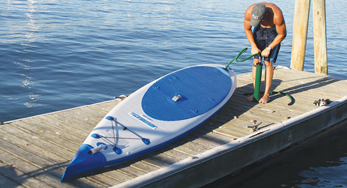 blowing up an inflatable paddleboard