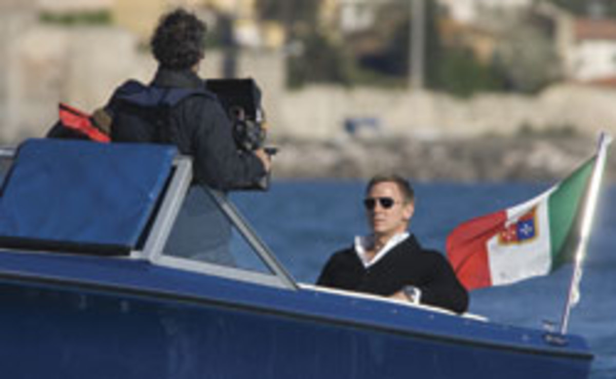 Dainel Craig as James Bond 007 riding in a restored 1970 Sunseeker Sovereign 17