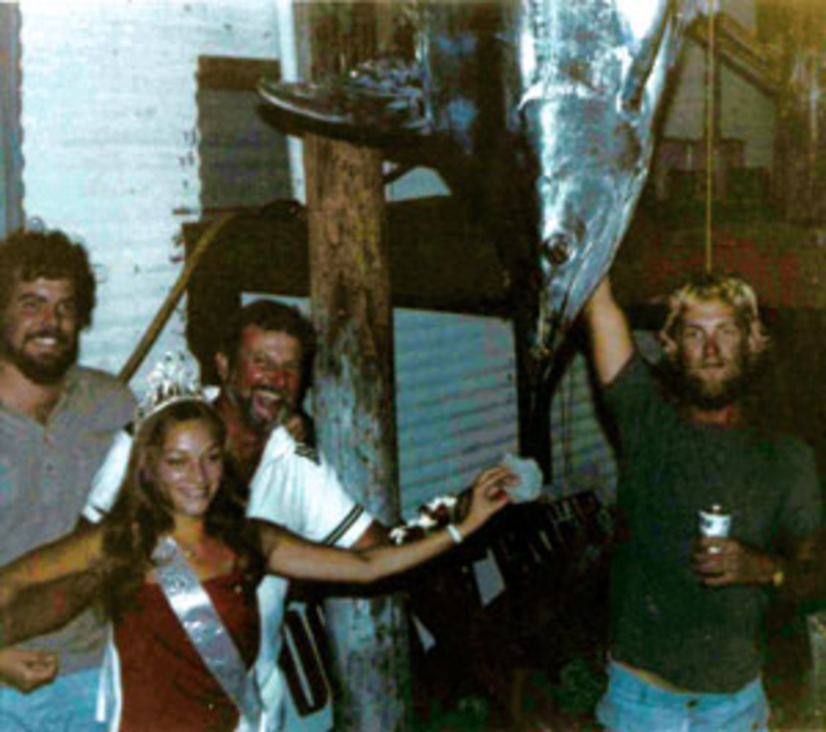 Michael Peters (left) and Harold Halter (center) at the Grand Isle Fishing Tournament, 1978. 