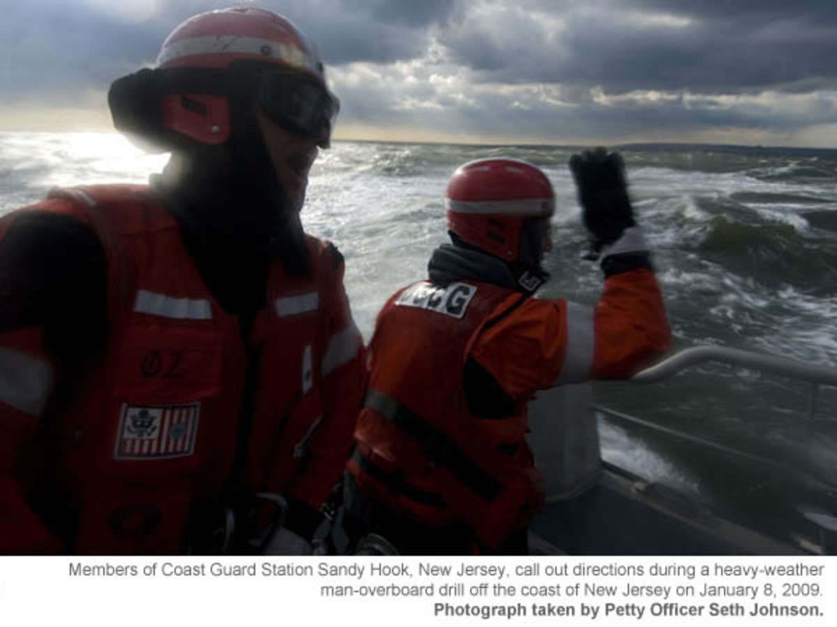 Members of Coast Guard Station Sandy Hook, New Jersey, call out directions during a heavy-weather man-overboard drill off the coast of New Jersey on January 8, 2009. Photograph taken by Petty Officer Seth Johnson. 