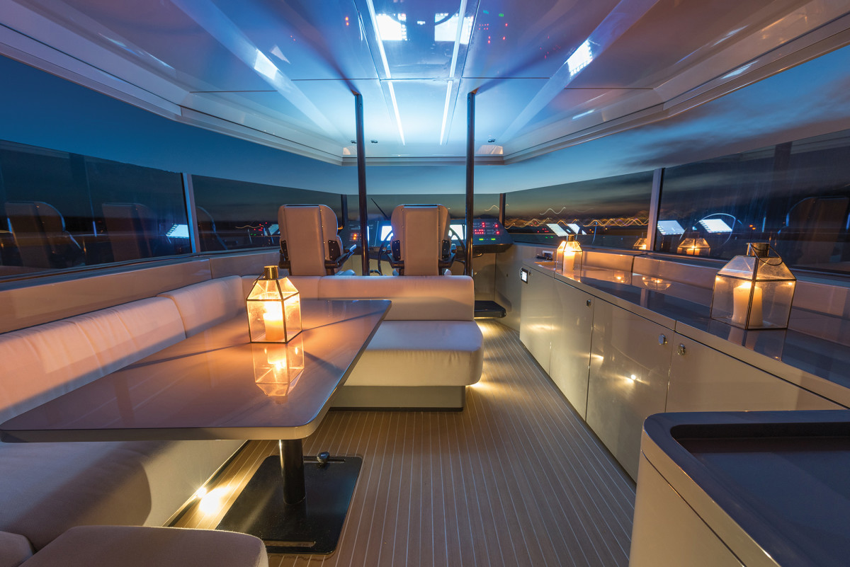 The roomy top deck is large for her 55-foot LOA, but the options really set the Arcadia apart. Those windows power up to enclose the space.