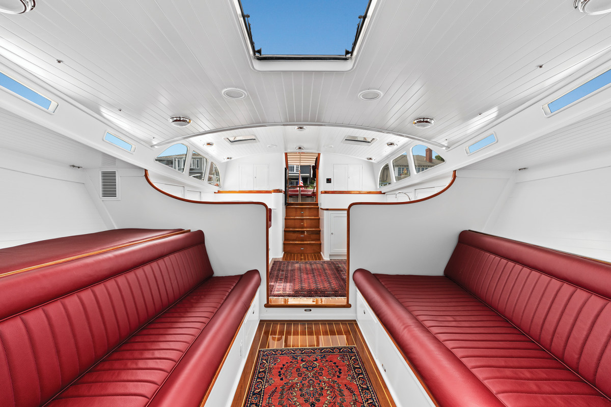 White linear polyurethane sets off the teak trim, teak and holly sole and faux-planked headliner for a new take on a classic Herreshoff look.