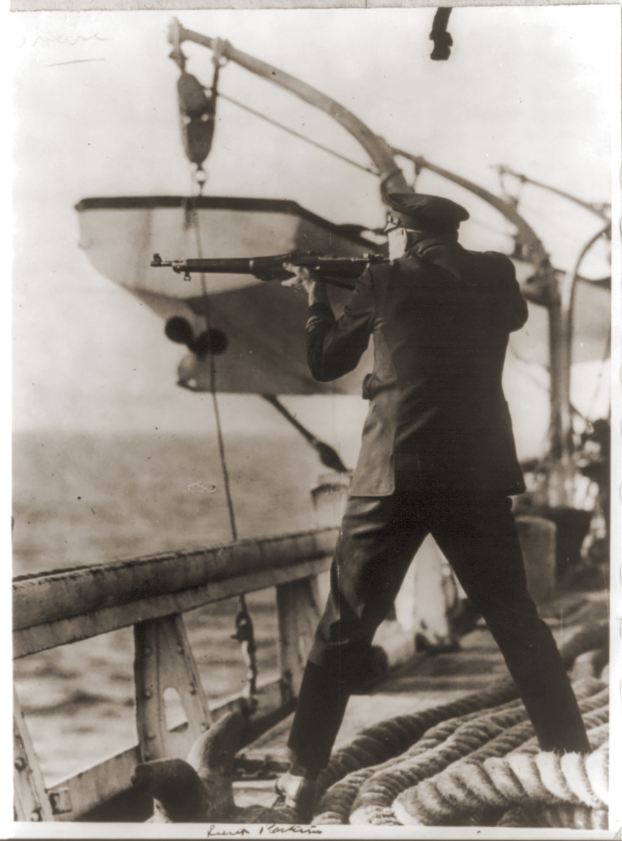 Lt. L.W. Perkins firing at a fleeing rum-running crew.