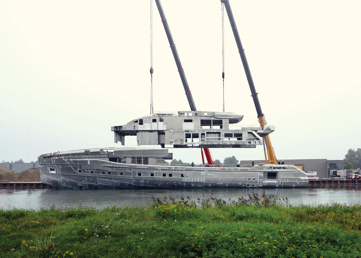 Project SkyFall is out of the, ahem, shed. That massive aluminum superstructure requires two industrial cranes just to get it situated onto the 194-foot-long decks.