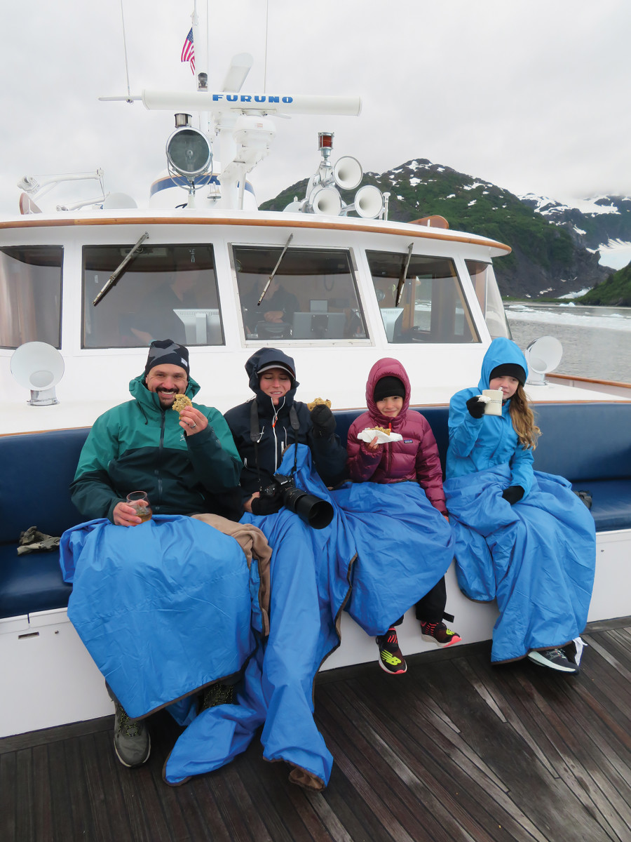 Glacier watching with blankets, cookies, and cocoa in-hand when cruising in Alaska.