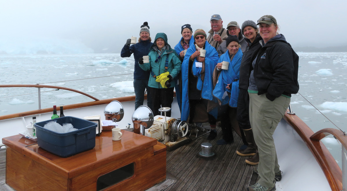 Tracy Meyer (right) with happy guests near Chenega Glacier.