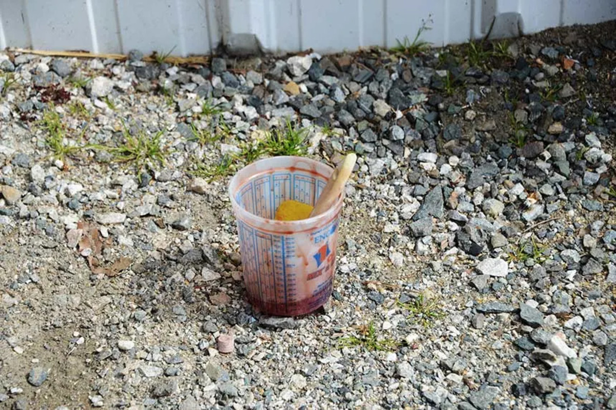 A common boatyard sight: excess resin in a cup left outside overnight. A container with catalyzed resin can generate enough heat to start a fire, and for that reason, we always leave them outside of the shops overnight. In the morning, before tossing it away, check to make sure the resin cured properly.