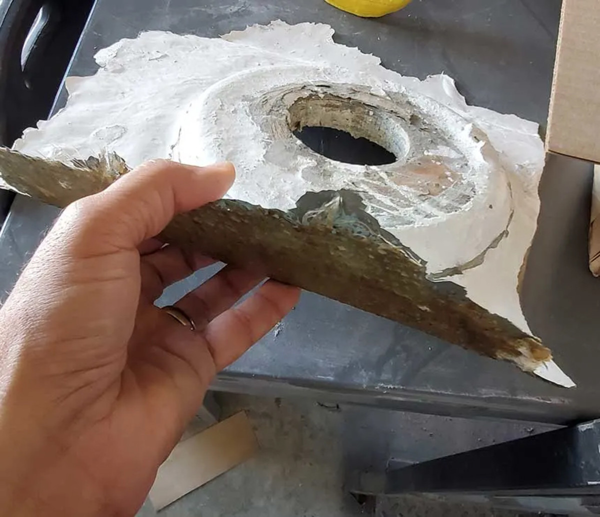 Polyester resin does not bond reliably to cured polyester. This part popped loose from the hull due to a failed bond, as a result of a poor resin choice and poor preparation.