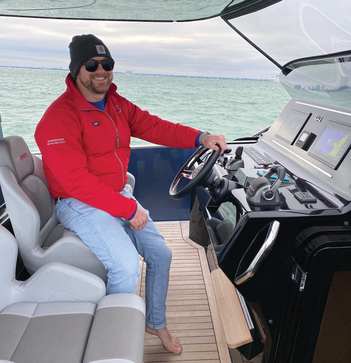 The author at the helm of the Solaris 44 Open on a blustery day in Miami.