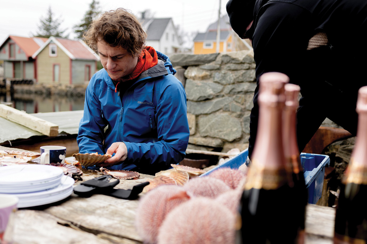 Evoy’s CTO Marius Dyrseth opening the fruits of his labor after diving for shellfish.